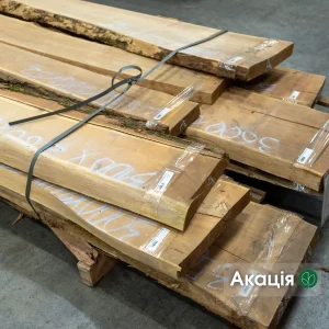 First grade unedged acacia boards bound in a bundle at the warehouse