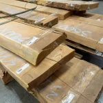 Thickness of unedged acacia lumber stacked in a warehouse