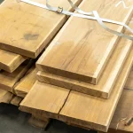 Color of kiln-dried edged acacia boards stacked in a bundle at the warehouse.