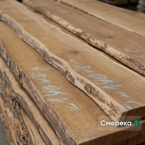 Unedged spruce boards with natural live edge and bark, close-up