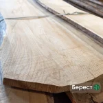 Extra grade, 52 mm unedged elm board showcasing light wood texture and grain.