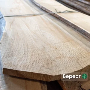 Extra grade, 52 mm unedged elm board showcasing light wood texture and grain.