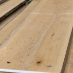 Close-up view of the natural texture of an extra grade 52 mm unedged beech board.