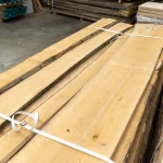 Width of extra grade 52 mm unedged beech board in a warehouse stack