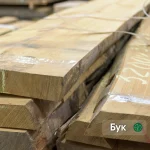 52 mm Grade 1 beech unedged boards stacked in a warehouse