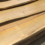 Smooth surface and warm golden-reddish tones of unedged cherry boards.