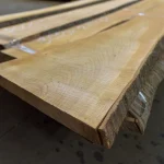 End cut and smooth surface of an extra grade unedged cherry board.