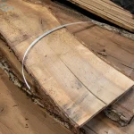Wood grain texture of a 52 mm unedged European walnut board