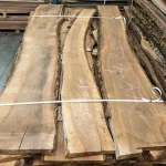 52 mm European walnut unedged live edge boards stacked in a warehouse