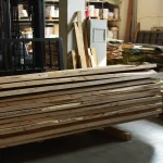 Stack of 52 mm grade 1 edged elm boards in a warehouse