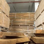 Stacked edged beech boards, 52 mm, in a warehouse storage area for furniture and stairs