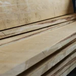 Edged oak boards with a thickness of 32 and 52 mm stacked in a warehouse