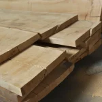 Extra grade edged oak boards stacked in a warehouse