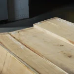 Kiln-dried grade 1 oak edged boards, 52 mm, stacked in the warehouse