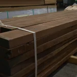 Dry American walnut edged boards 55 mm strapped together in a warehouse