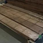Extra grade 52 mm American black walnut edged boards stacked in a warehouse
