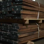 Wholesale and retail sales of American walnut lumber boards 52 mm stored on pallets.