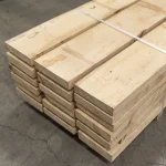 Stack of dry edged hornbeam boards 52 mm in a warehouse available wholesale or retail.