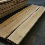Long edged maple boards laid out on the floor to showcase their natural light color.