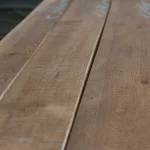 Perspective view showing the fine wood grain and uniform color of premium spruce boards.
