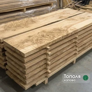 A neat stack of premium edged poplar burl boards of Grade 1 in a woodworking warehouse.