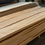 Neat stack of kiln-dried extra class edged alder lumber boards.
