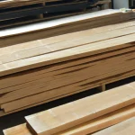 Large volume of sorted extra grade alder boards stored in a facility.