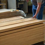 Process of selecting and quality checking long edged alder boards.