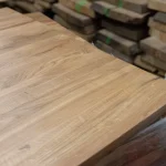 Perspective view of the rustic oak furniture board surface in a warehouse setting.