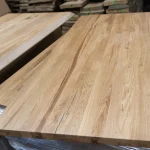 Full-length view of the solid lamellas on the rustic oak furniture board.