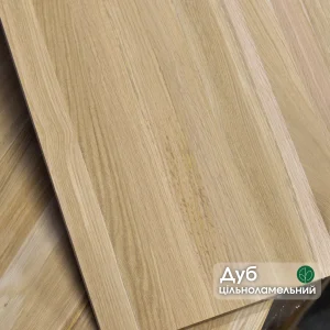 Solid-lamella oak furniture panel with a label highlighting the premium wood quality.