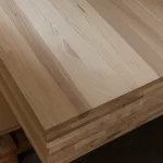 Corner detail of stacked 20mm ash furniture boards showing clean cuts and premium quality.