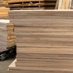 Side view of a high stack of ash panels showing uniform 20mm thickness and clean edges.