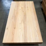 Full view of a single solid-lamella ash furniture panel showing its complete surface.