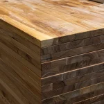 Side view of stacked 40mm ash panels showing the thickness and solid lamella construction.