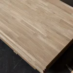 Corner view of a stack of finger-jointed oak boards 18mm.