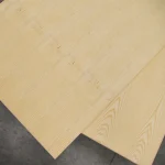 Two overlapping sheets of ash veneered blockboard showing consistent grain matching.