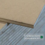 Close-up of the corner of a 13 mm HDF-faced blockboard showing the inner wood core and outer HDF layers.