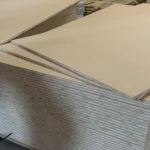 Stack of HDF-faced blockboards showing the solid wood core structure.
