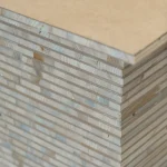 Detailed view of the edge of stacked HDF-faced blockboards.