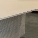 Corner view of a single HDF-faced blockboard panel showing its smooth surface.