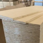 General view of a stack of 38 mm HDF-faced blockboards in a warehouse environment.