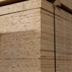 Side view of a strapped pallet of Ceiba blockboards ready for shipping.