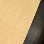 Top view of a white ash veneered blockboard sheet highlighting its uniform light wood texture.