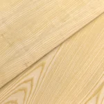 Two overlapping sheets of ash veneered blockboard displaying different grain variations.