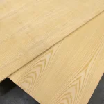 Two overlapping sheets of ash veneered blockboard showcasing different natural grain patterns.