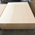 Front view of a neat stack of 19mm white ash veneered blockboards.