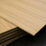 Close-up of the edge of an oak veneered blockboard sheet, revealing the solid wood core.