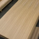 High-angle view of a premium oak veneered blockboard sheet with uniform texture.