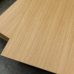 Two overlapping sheets of oak veneered blockboard, demonstrating consistent color and grain.